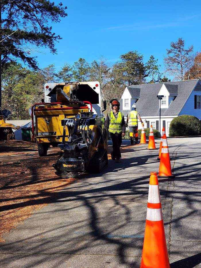 Crew and chipper working a neighborhood street